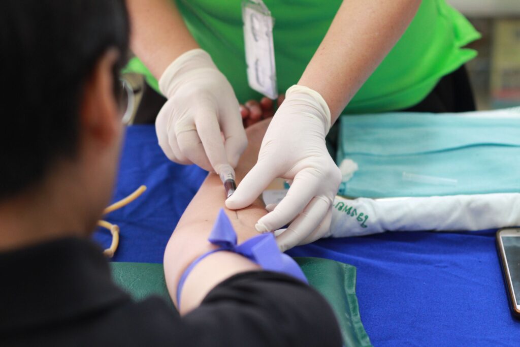 A healthcare professional giving a patient an injection in the arm